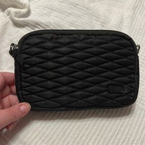 LUG coupe in black with Crossbody strap and a wrist strap to use as a clutch.